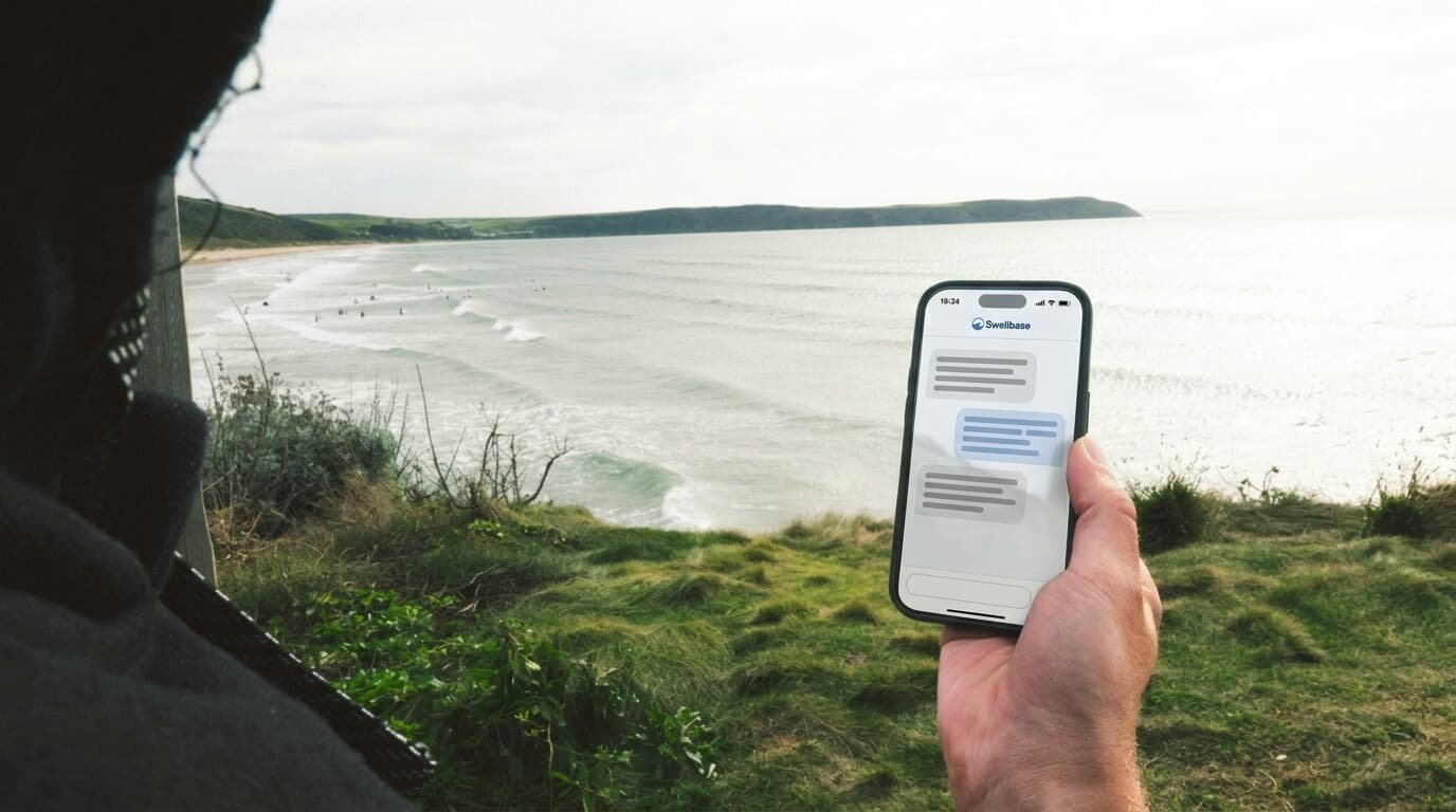 An operator checking their centre's day on Bodhi from the coast path